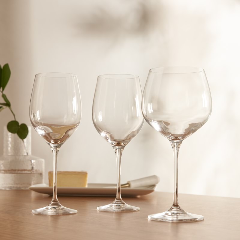 fine wine glasses on a wooden table